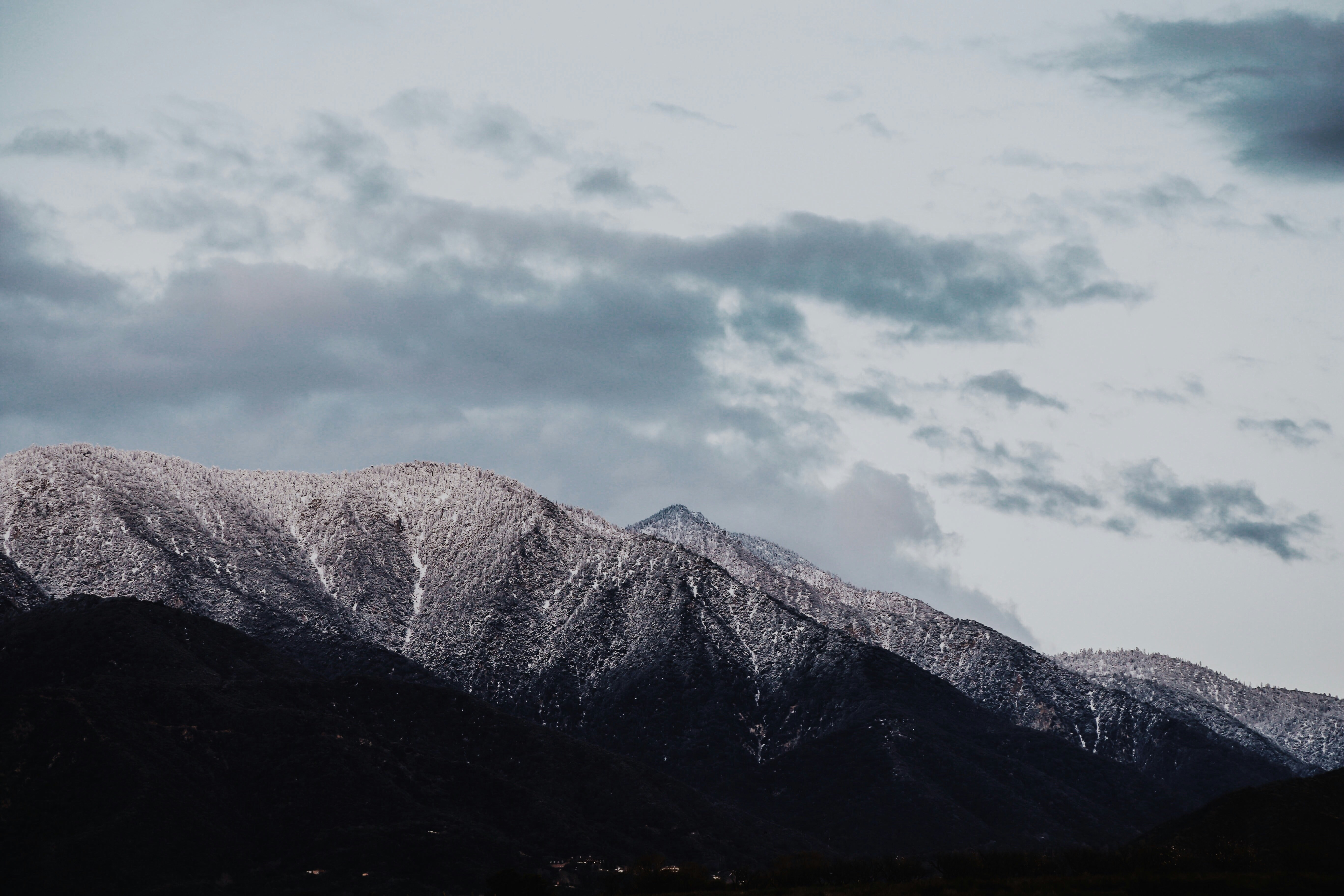 gray mountains under gray clouds